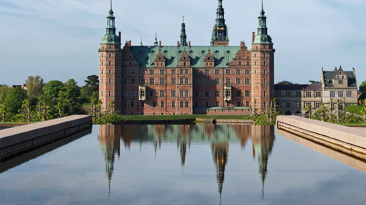 Frederiksborg Palace reflected in its canal on an easy-pace Hamlet Castle tour from Copenhagen
