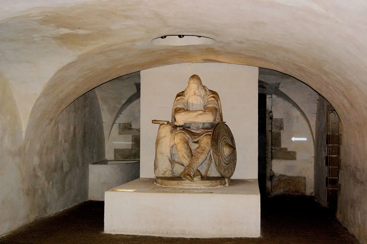 The sleeping statue of Holger Danske in the casemates under Kronborg, a highlight of Hamlet Castle tours